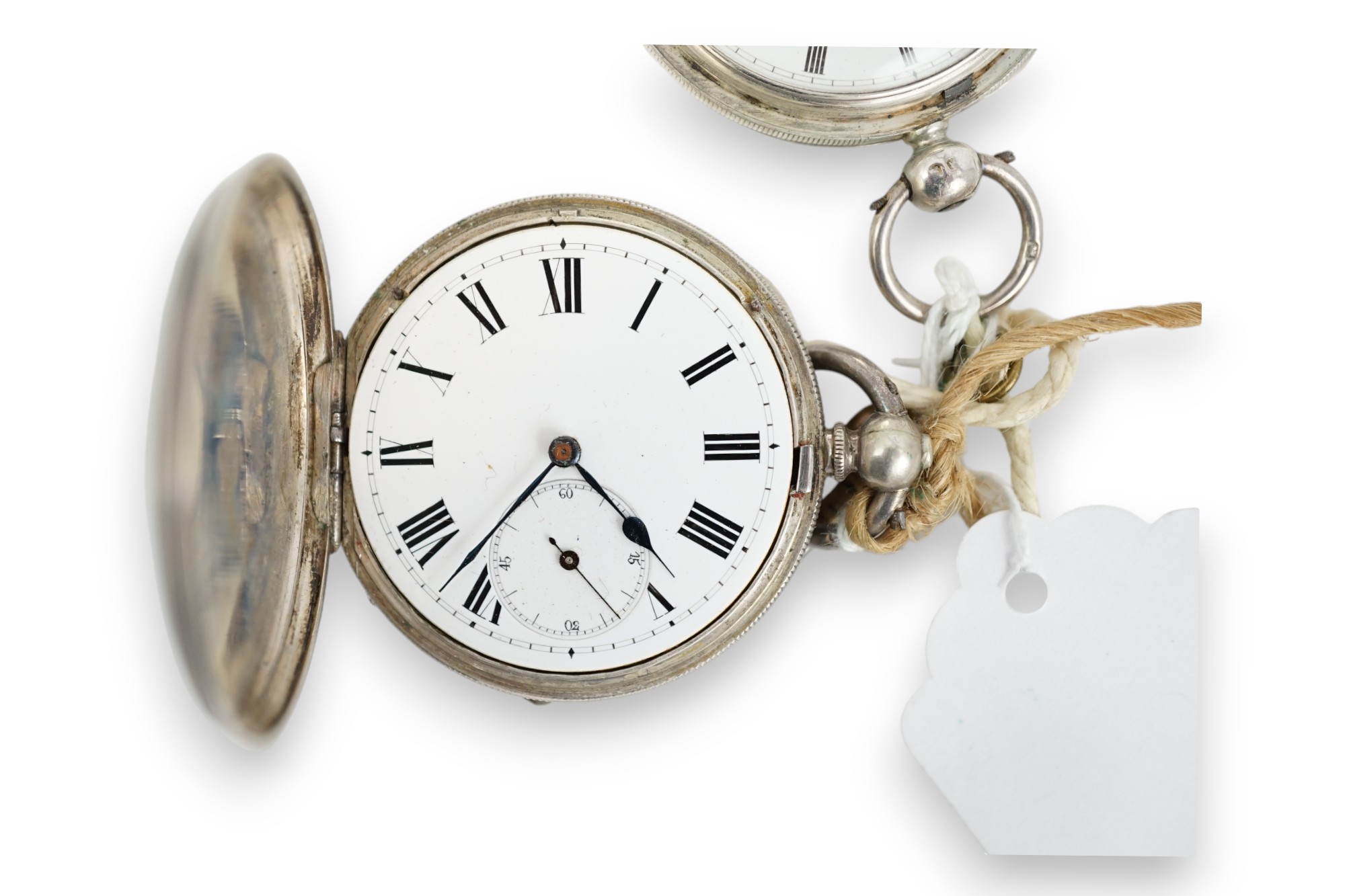 A Victorian silver hunter keywind pocket watch and an engine turned white metal pocket watch.